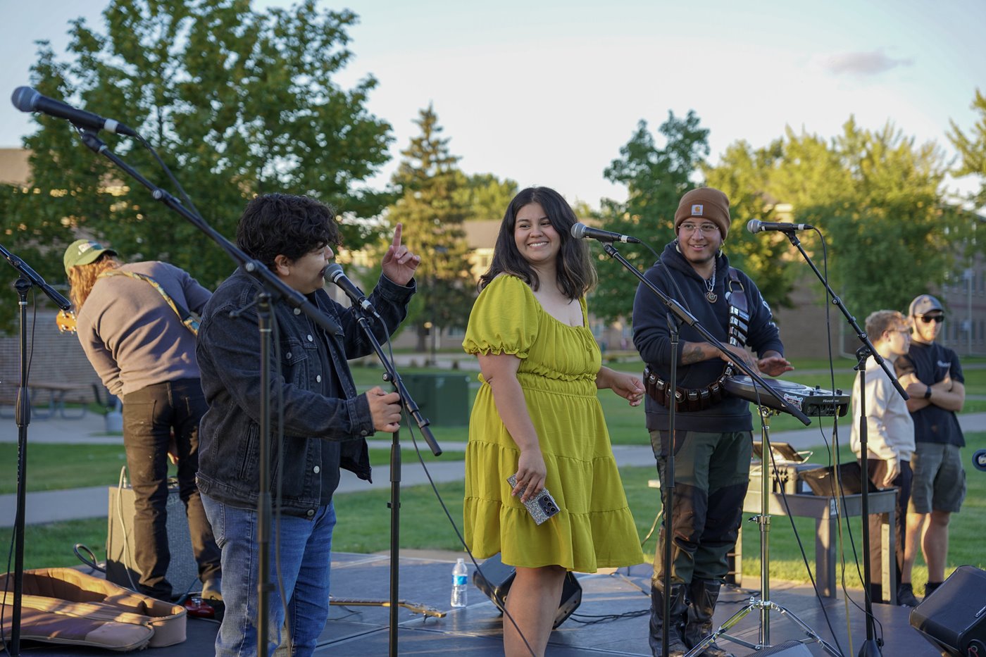 A band performs on an outdoor stage