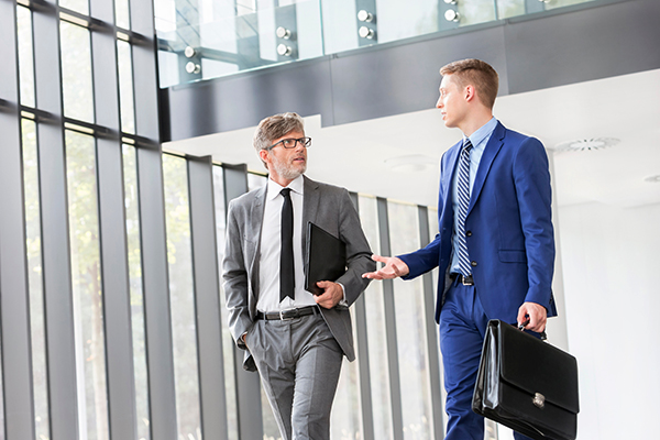 Two businessmen conversing