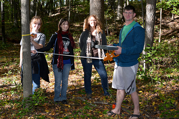 Students measuring trees