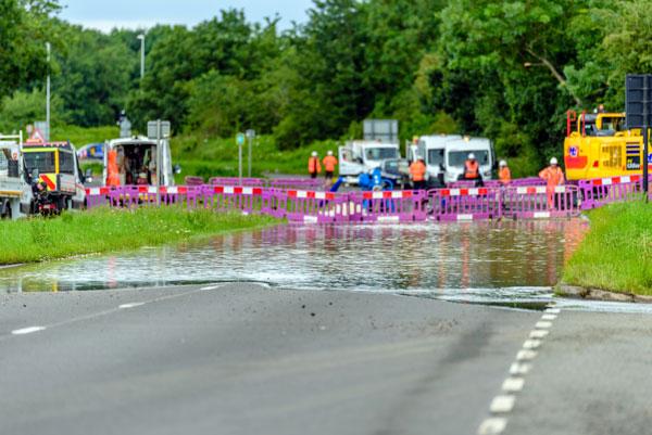 Emergency response vehicles flooded roadway