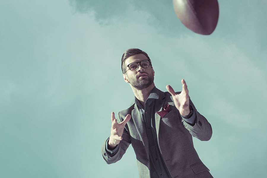 corporate training concept businessman catching football