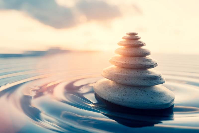 stones stacked in still water