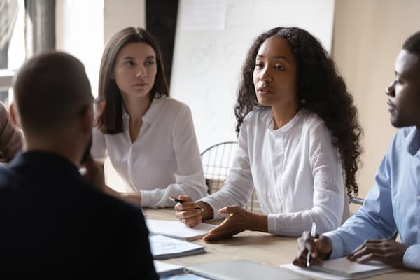 Coworkers discussing business concepts