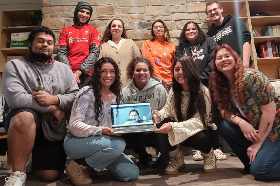 Diverse group of students smile for photo