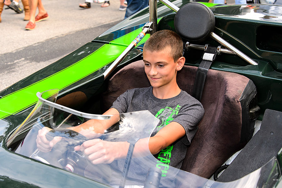 Boy driving racecar