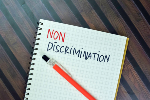 Notebook with "non discrimination" written on it