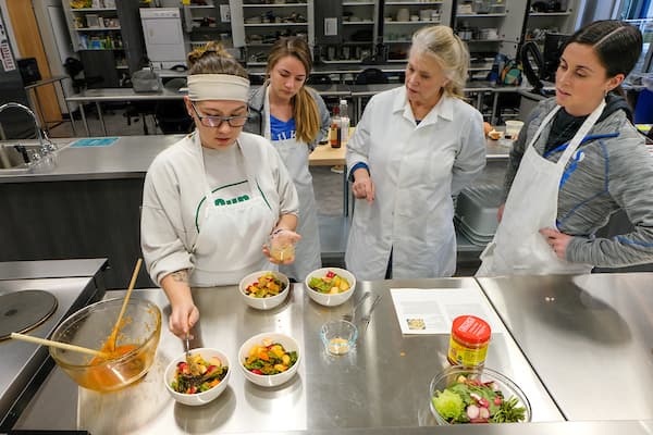 Nutrition Professor teaches students in UW-Green Bay's industrial kitchen