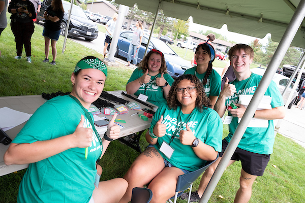 Students helpers smiling on move in day