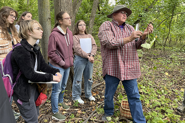 Outdoor field trip with students and Indigenous leader