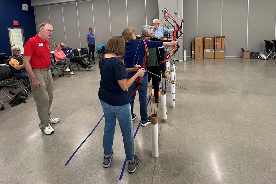 instructor talking to archery class