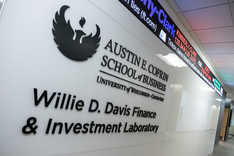 Photo of outside wall with logo and signage for Willie D Davis Finance and Investment Laboratory