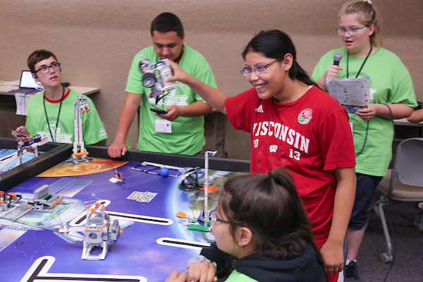 Group of campers working on robotic engineering