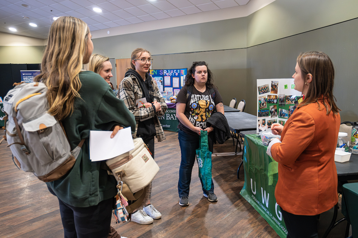 Students speak with a representative from the Uw-Green Bay Personal Financial Planning Association