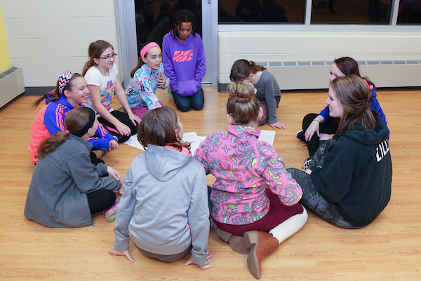 Children sit in circle at YMCA