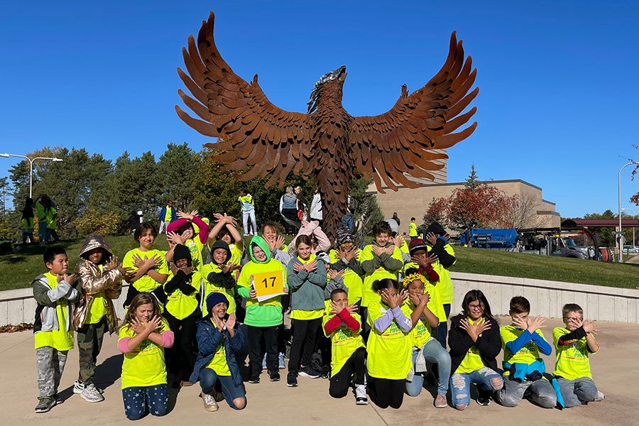 Group of students in front of Phoenix sculpture