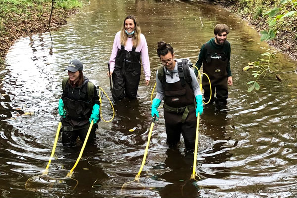 Group of students testing water