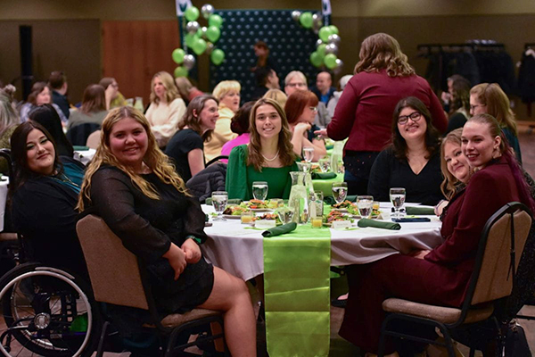 Students at table during awards ceremony