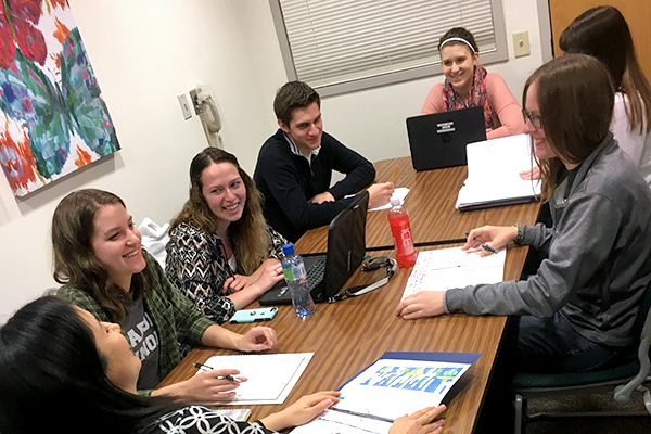 Student researchers in a lab meeting