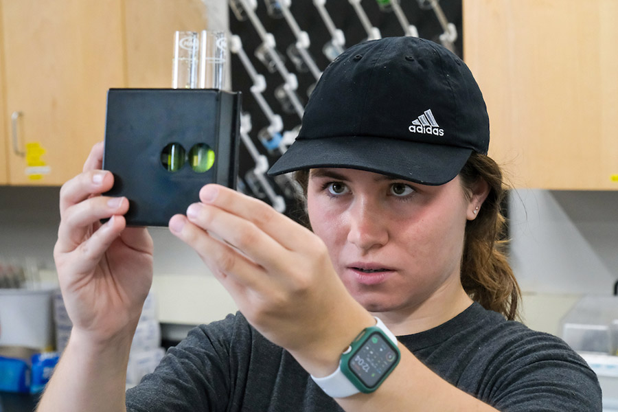 Student in water testing lab