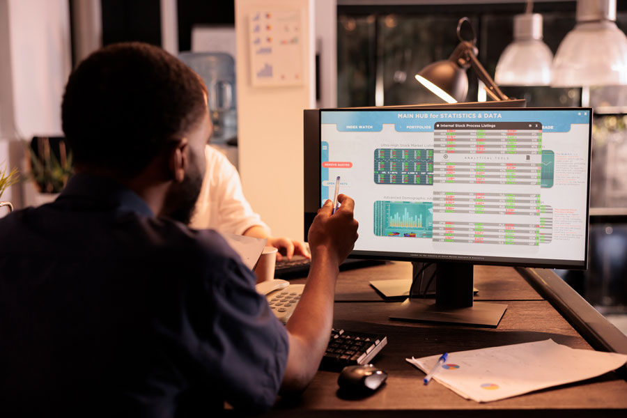 Employee working on analytics on computer