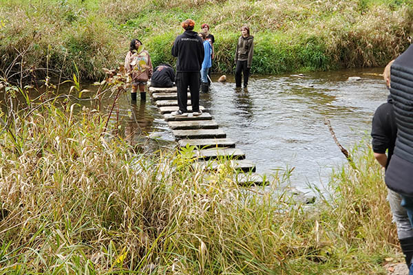 Students working in creek