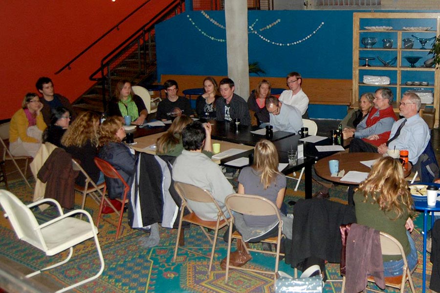 Large group discussion in cafe