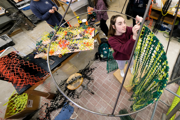 student working on art sculpture