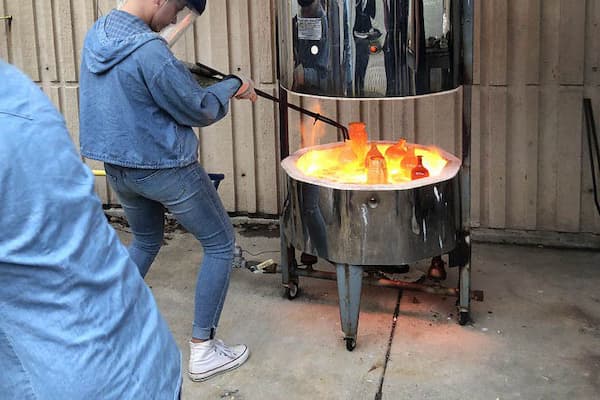 Student practices raku firing