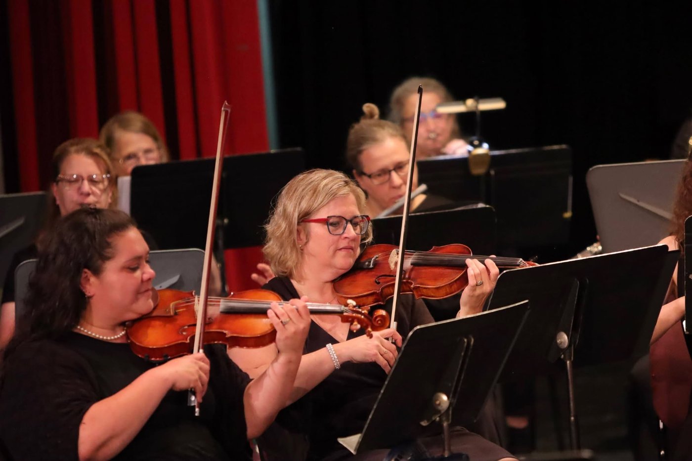 People Playing Violins