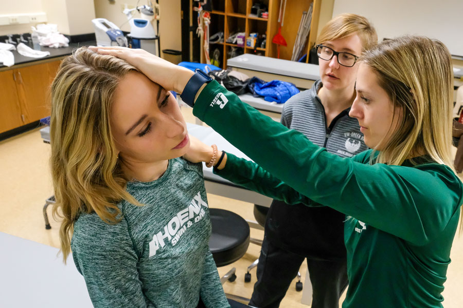 UW-Green Bay students practice physical therapy techniques on peer