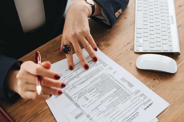 person filling out tax form