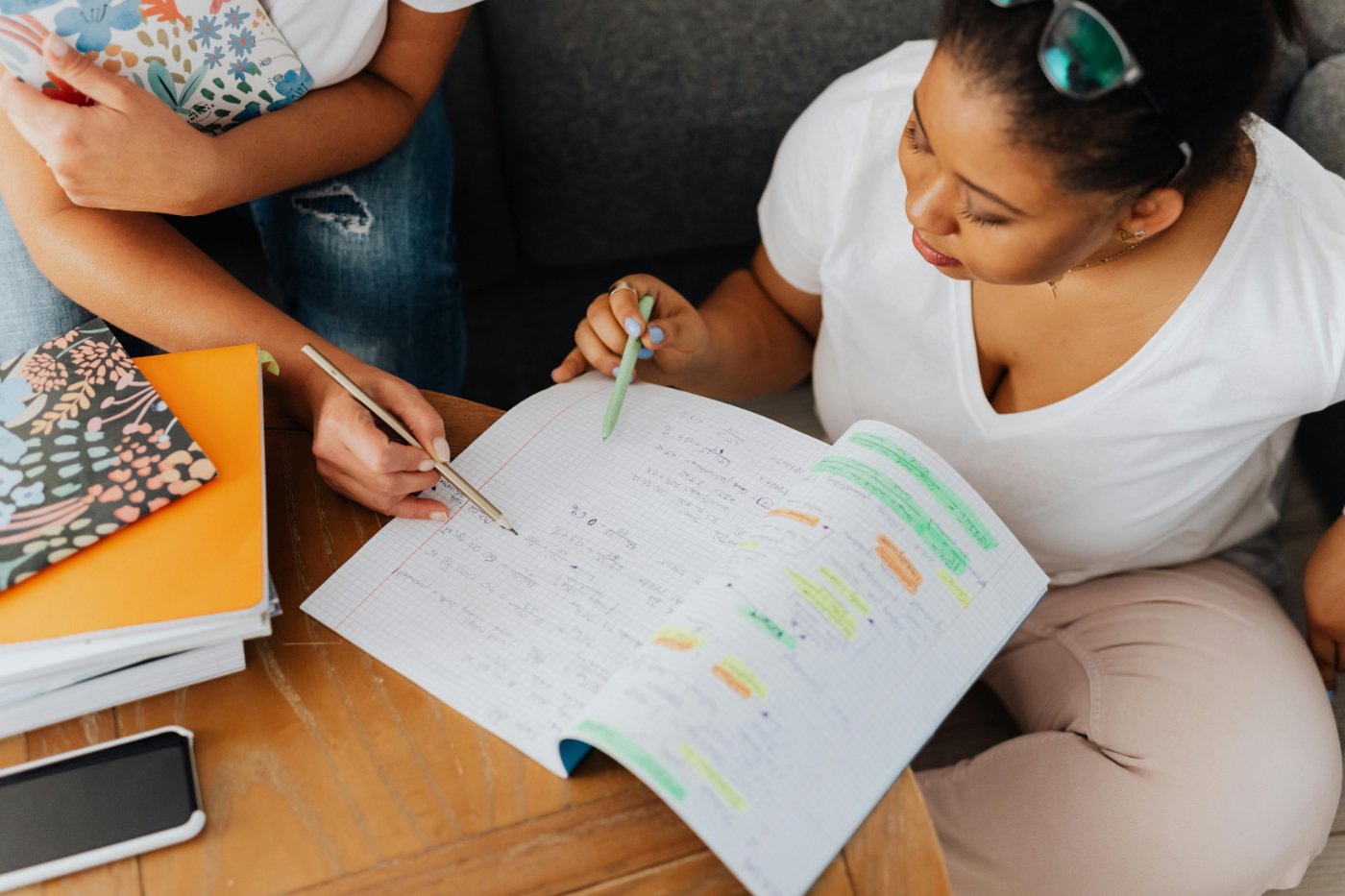 Tutor helping student with math