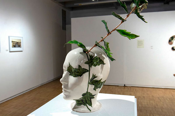 Sculpture of head with vines