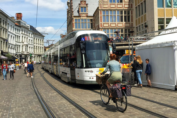 Person riding bike in city abroad