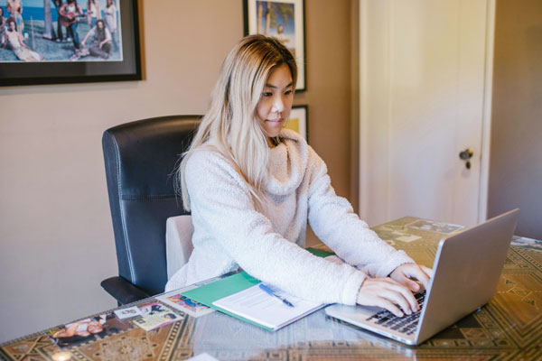 Person typing on laptop