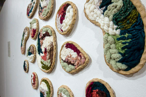 Fiber art displayed on wall