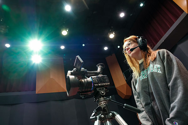 UWGB Communication student runs one of the three video cameras during the filming and production of a live television talk show