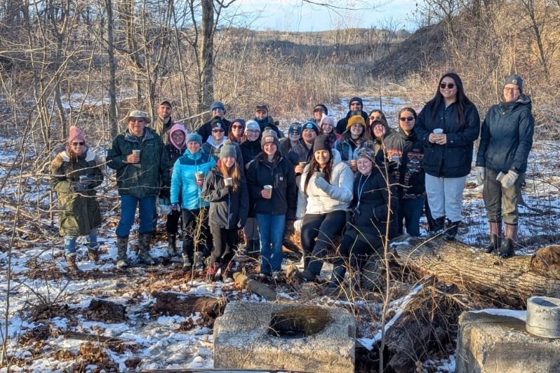 Group of students tapping trees in the Oneidas community