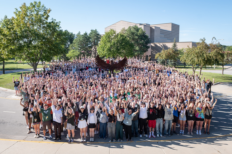 first-year class photo in front of the phoenix statue