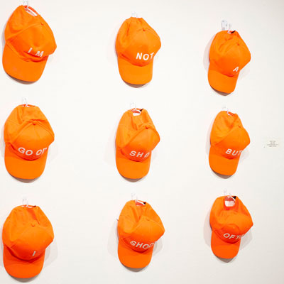 Orange hats on wall