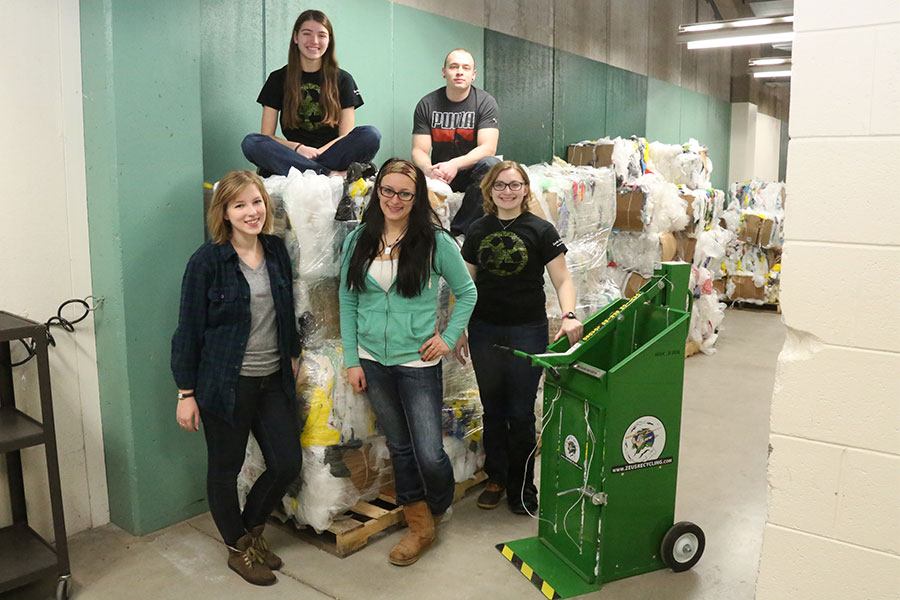 Mathew Malcore and peers with plastic film bales from the UWGB recyclinig project