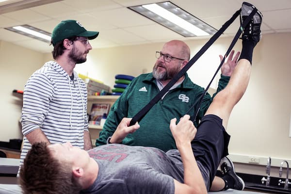 Athletic Training professor teaches students stretching techniques