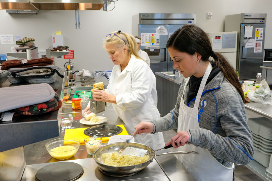 Professor and student work in UW-Green Bay's industrial kitchen