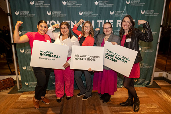 group of five women making the Accelerate Action pose