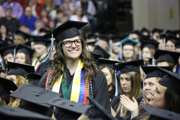 student smiling at commencement