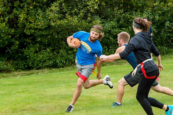 Students play flag football