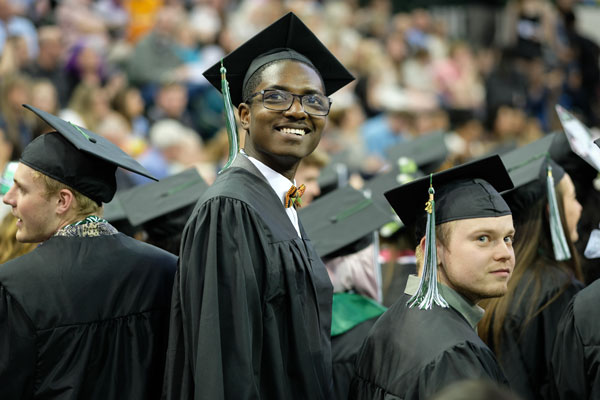 African American student smiles at graduation