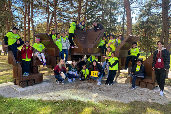 Students and mentor on an outdoor scultpture