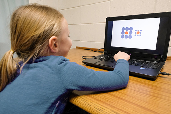 Child working on laptop