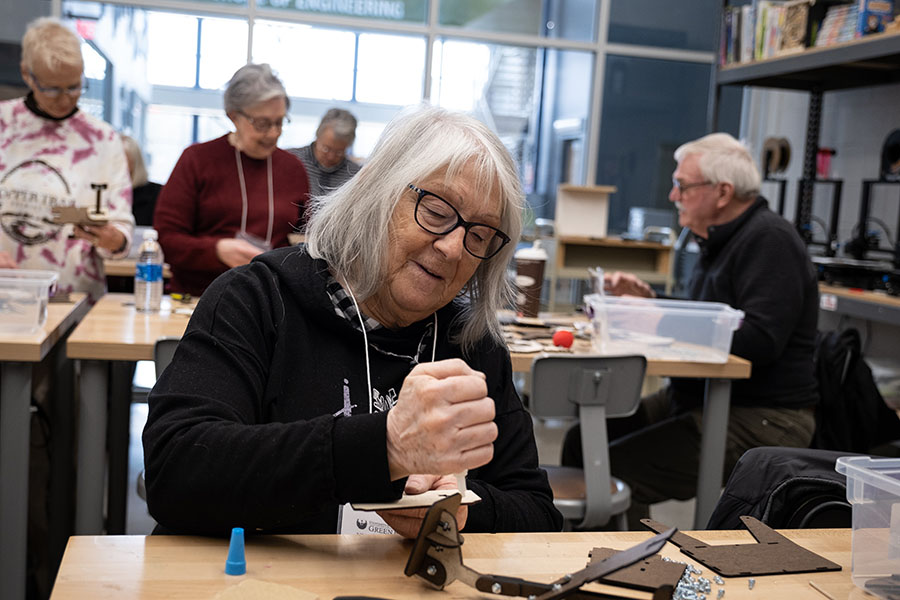 Lifelong Learning member working on a craft project